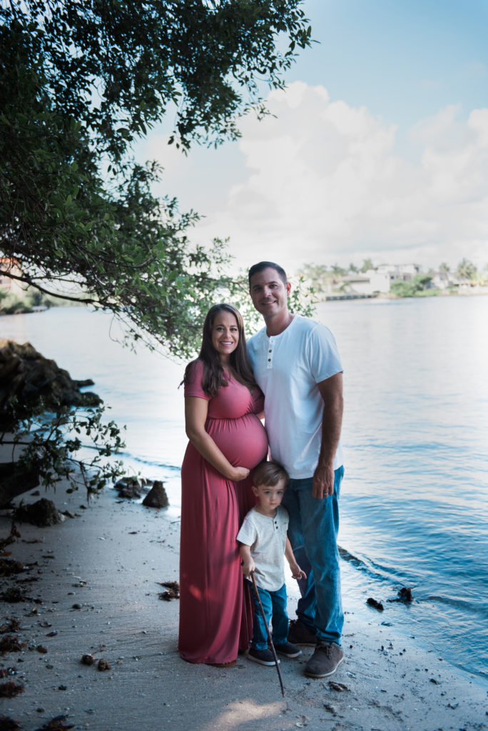 Mom, Dad and son by the water