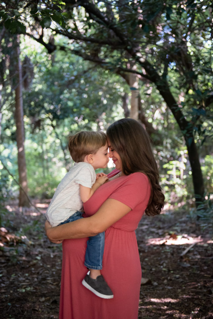 Mom and son foreheads together