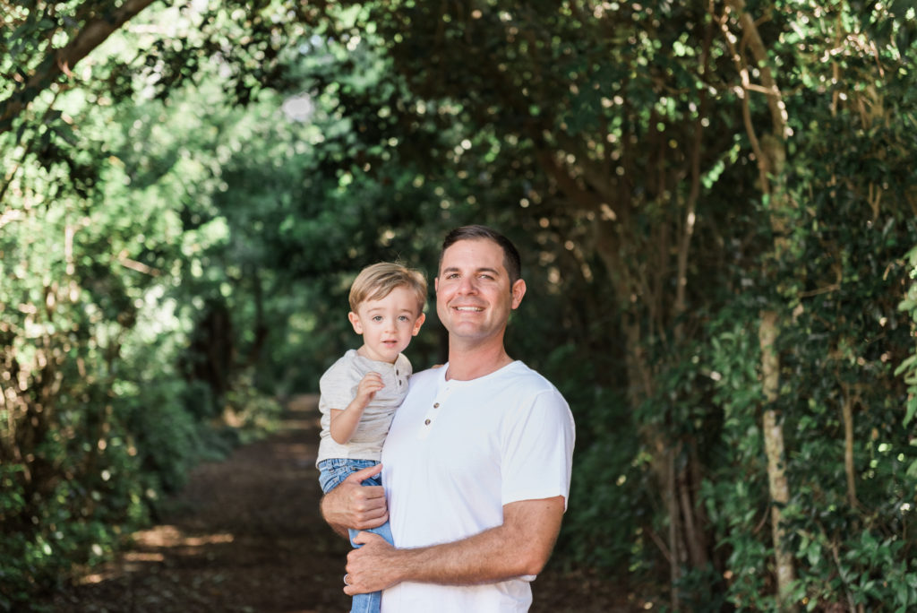 Dad holding son