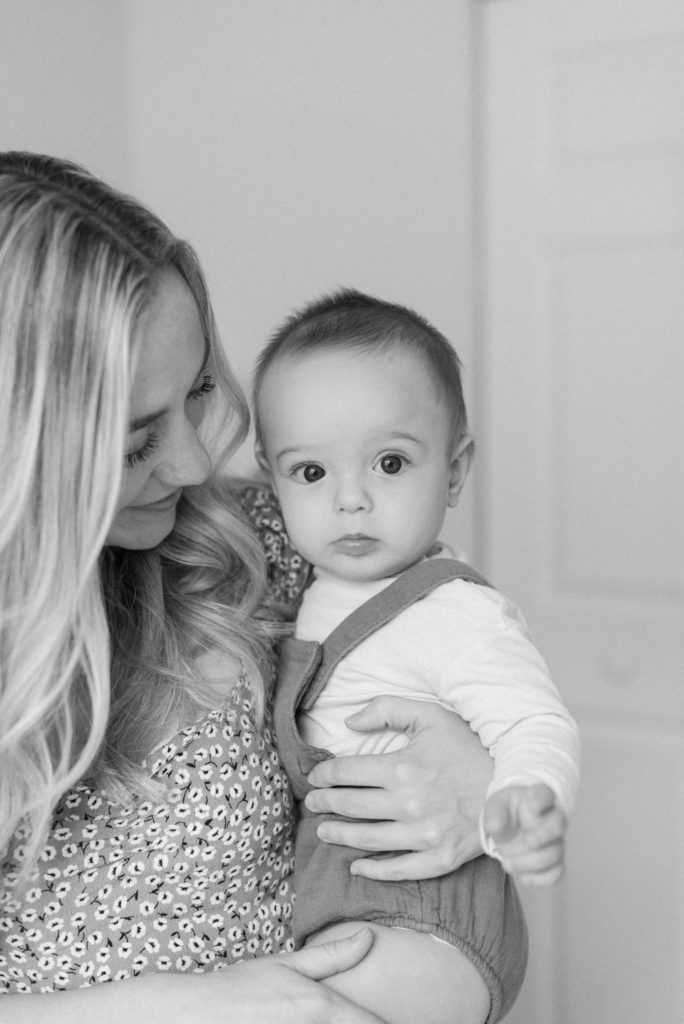 Mom looking lovingly at baby in black and white