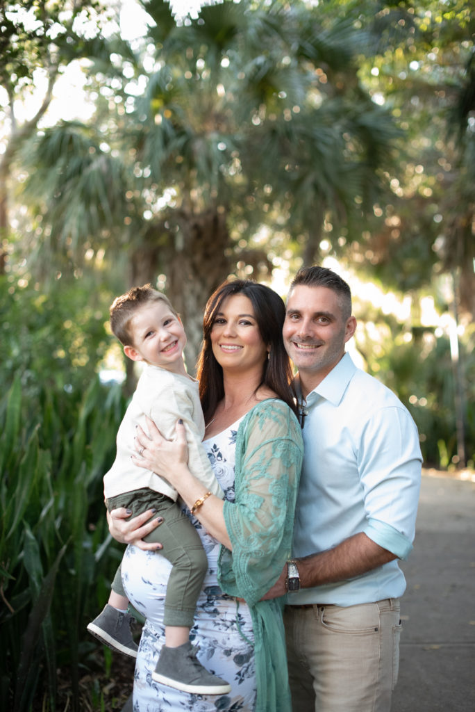 Mom, Dad and son smiling at the camera