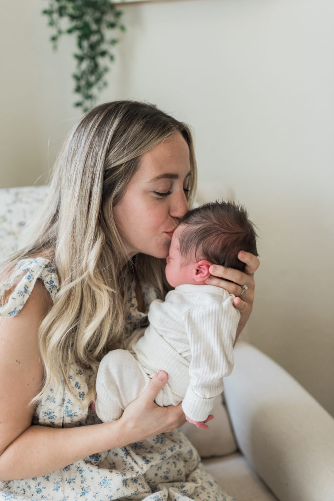 Close up on mom kissing baby