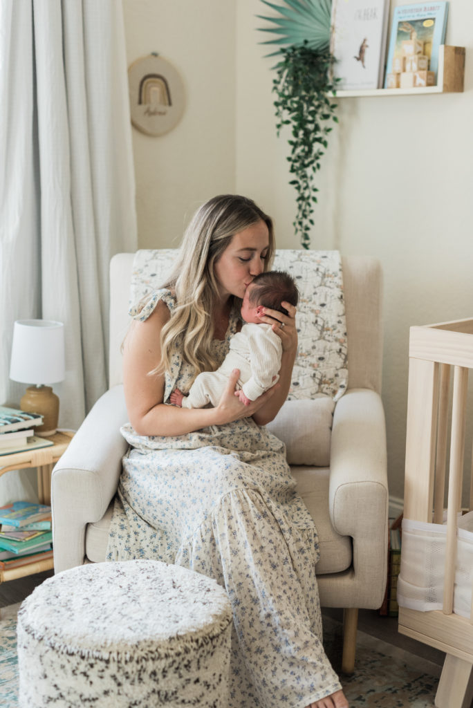 Mom kissing baby on forehead