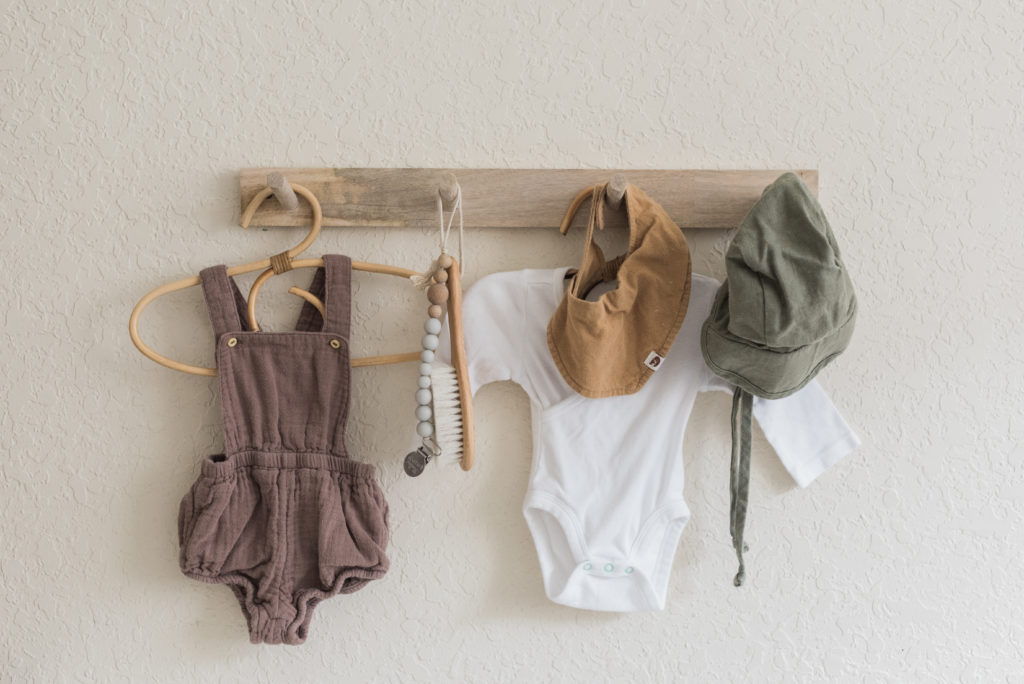 Hanging clothes in nursery