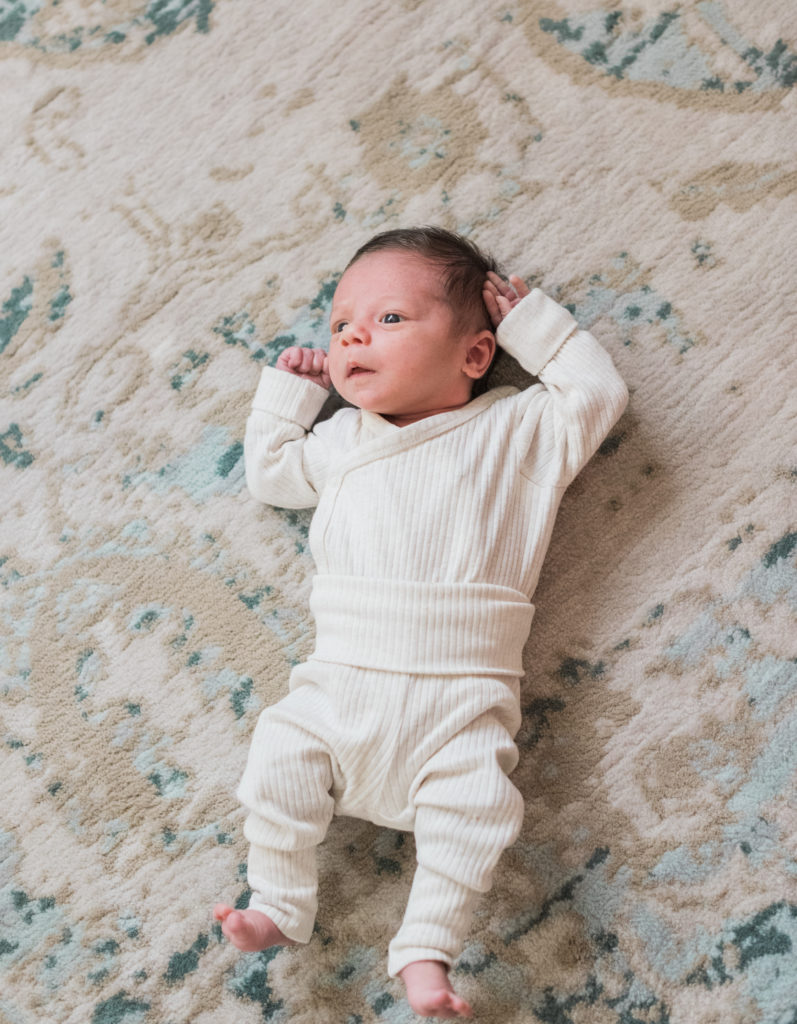 Baby laying on floor