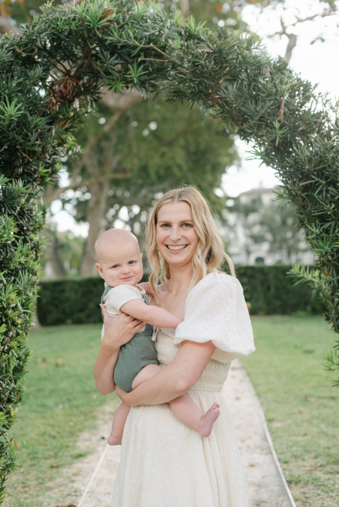 Mom and baby looking at camera, smiling