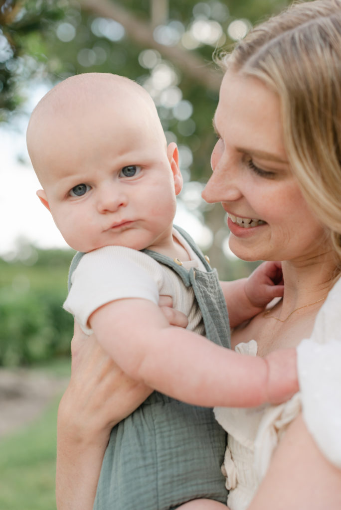 Mom smiling looking at baby