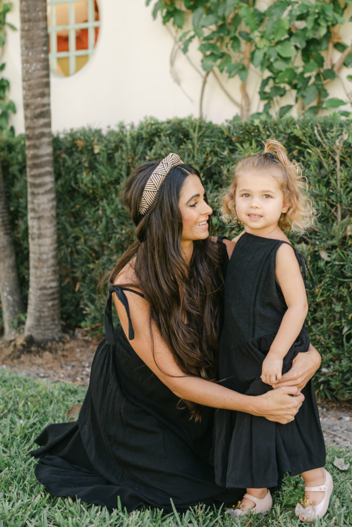 Mom looking at daughter, smiling