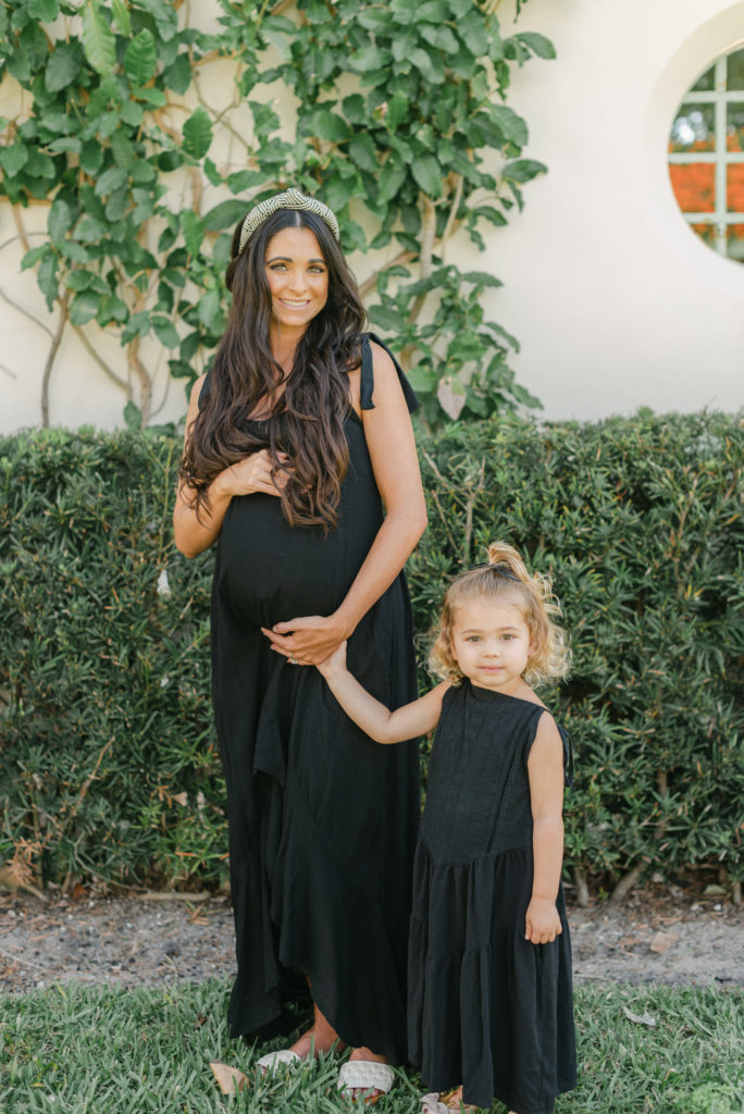 Mom holding daughter's hand