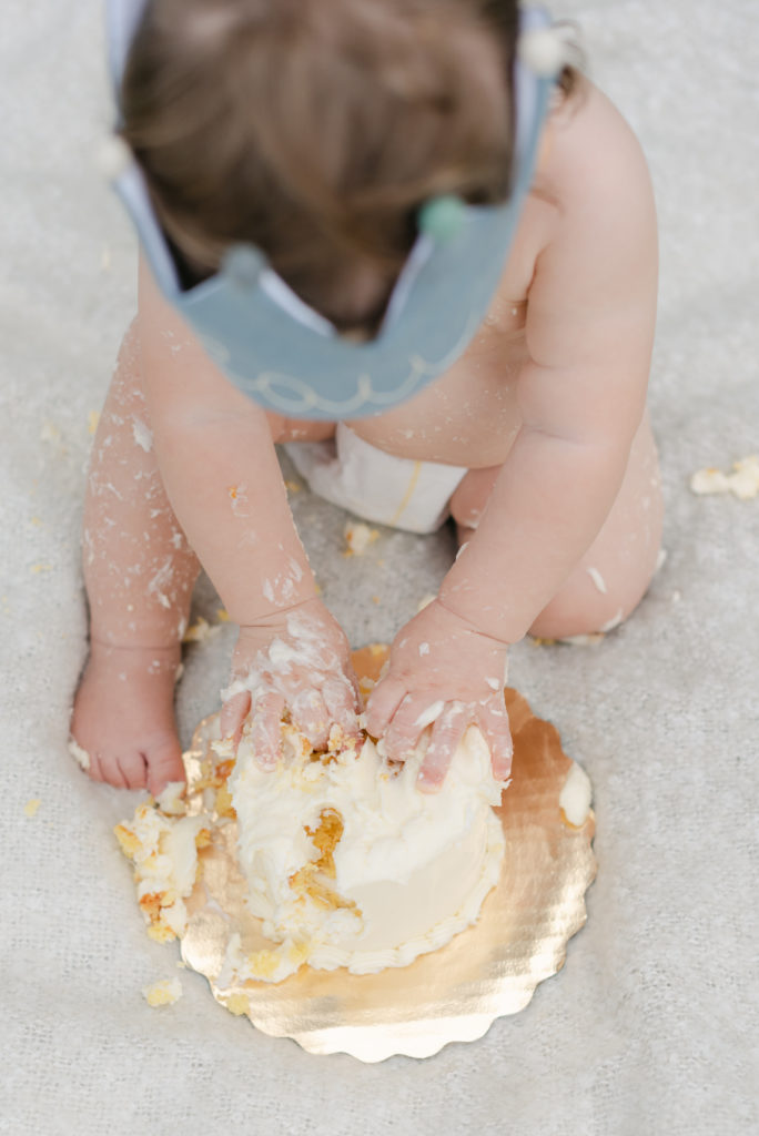 Top down view of hands in cake