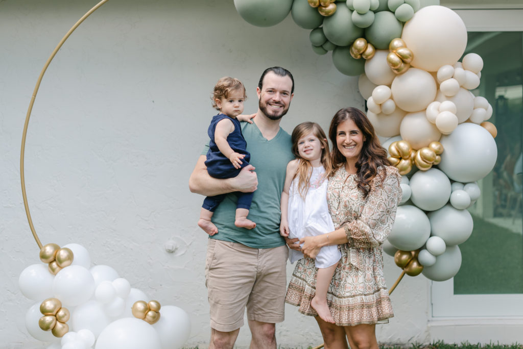 Family photo in front of balloons