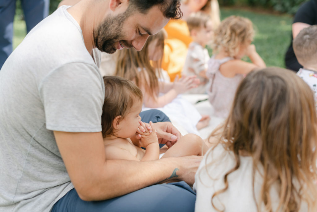 Dad and daughter watching music teacher