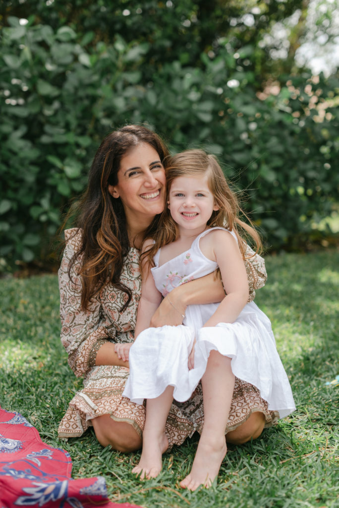 Mom and daughter looking at camera