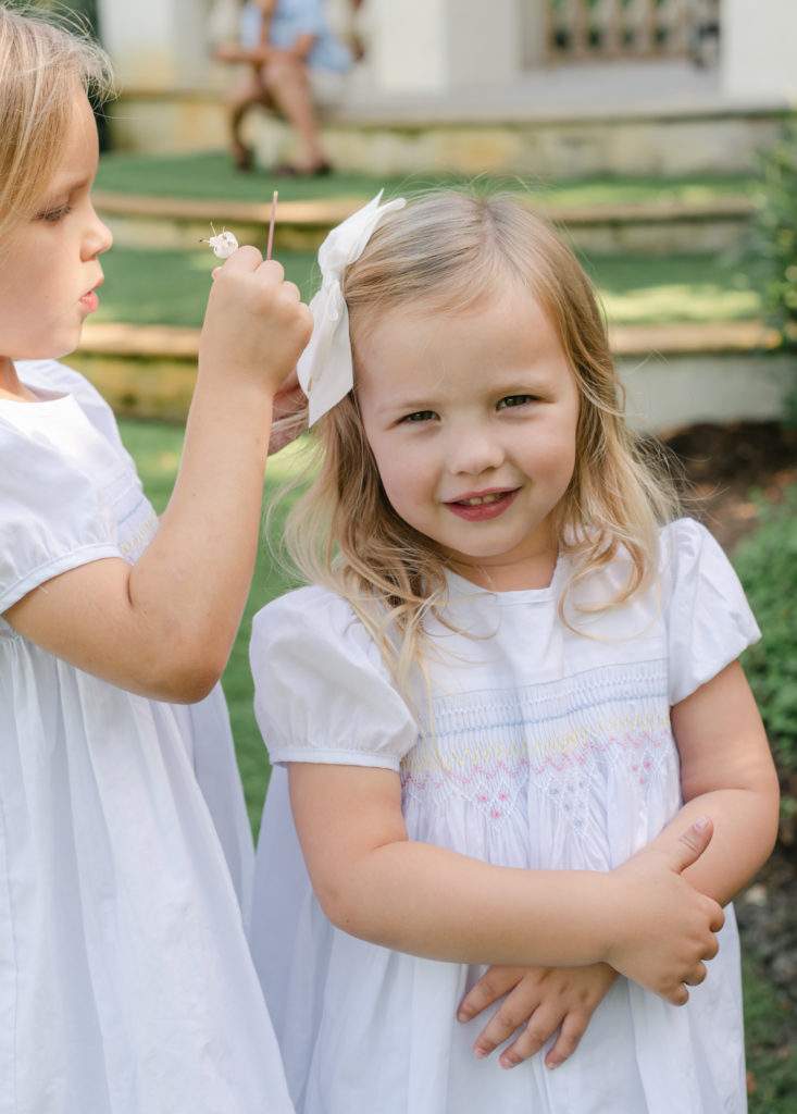 Sisters fixing each other's hair