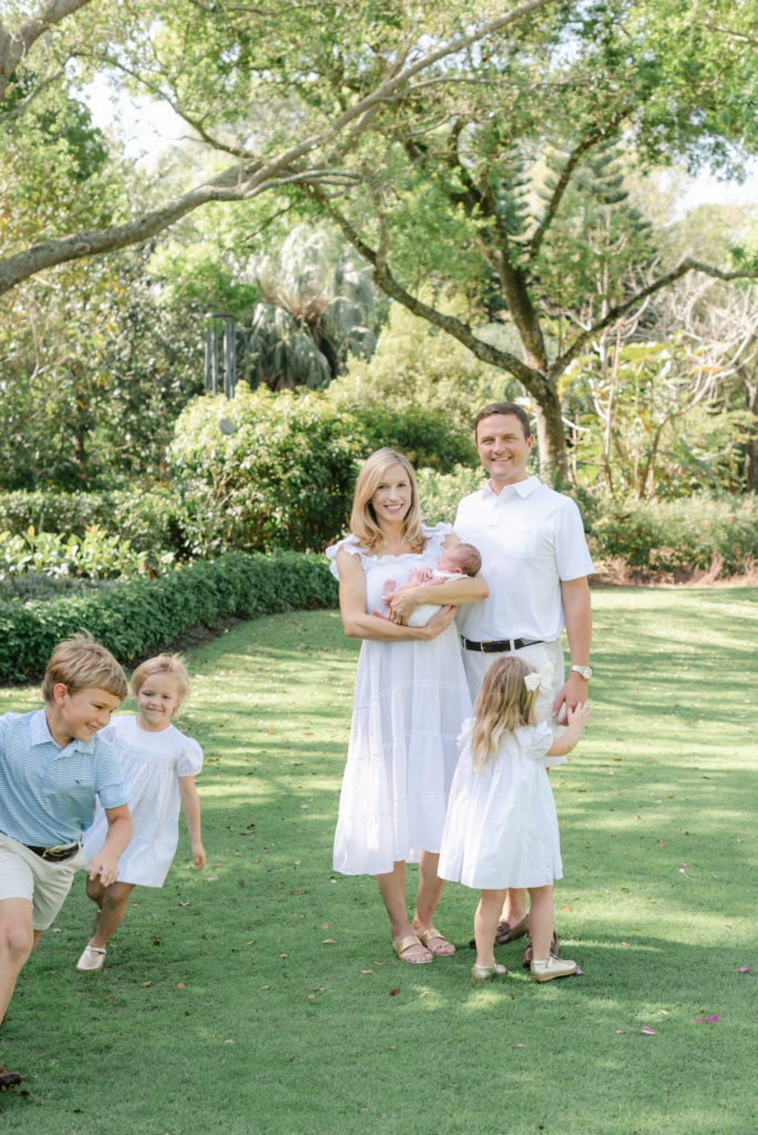 Mom and dad together, kids running