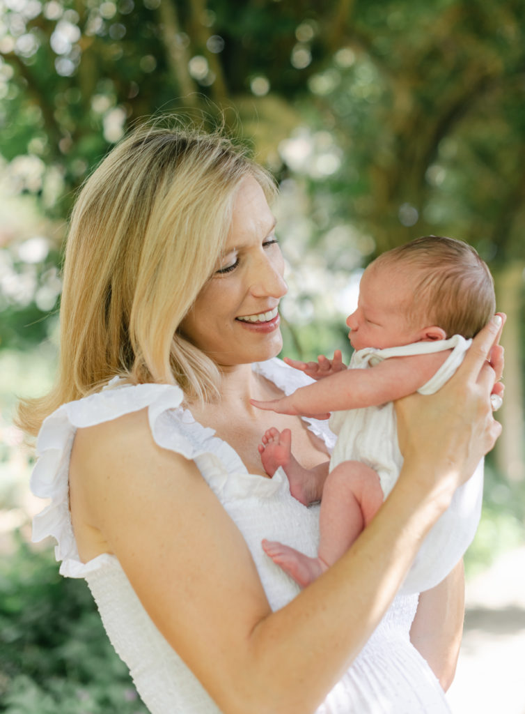 Mom holding up baby