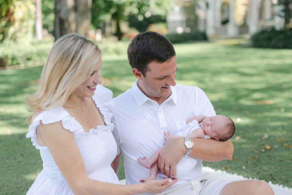 Close up of mom and dad looking at baby