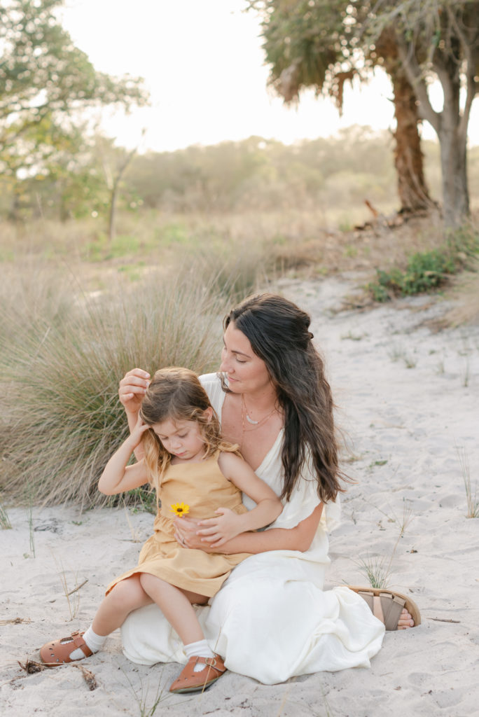 Mom fixing daughter's hair