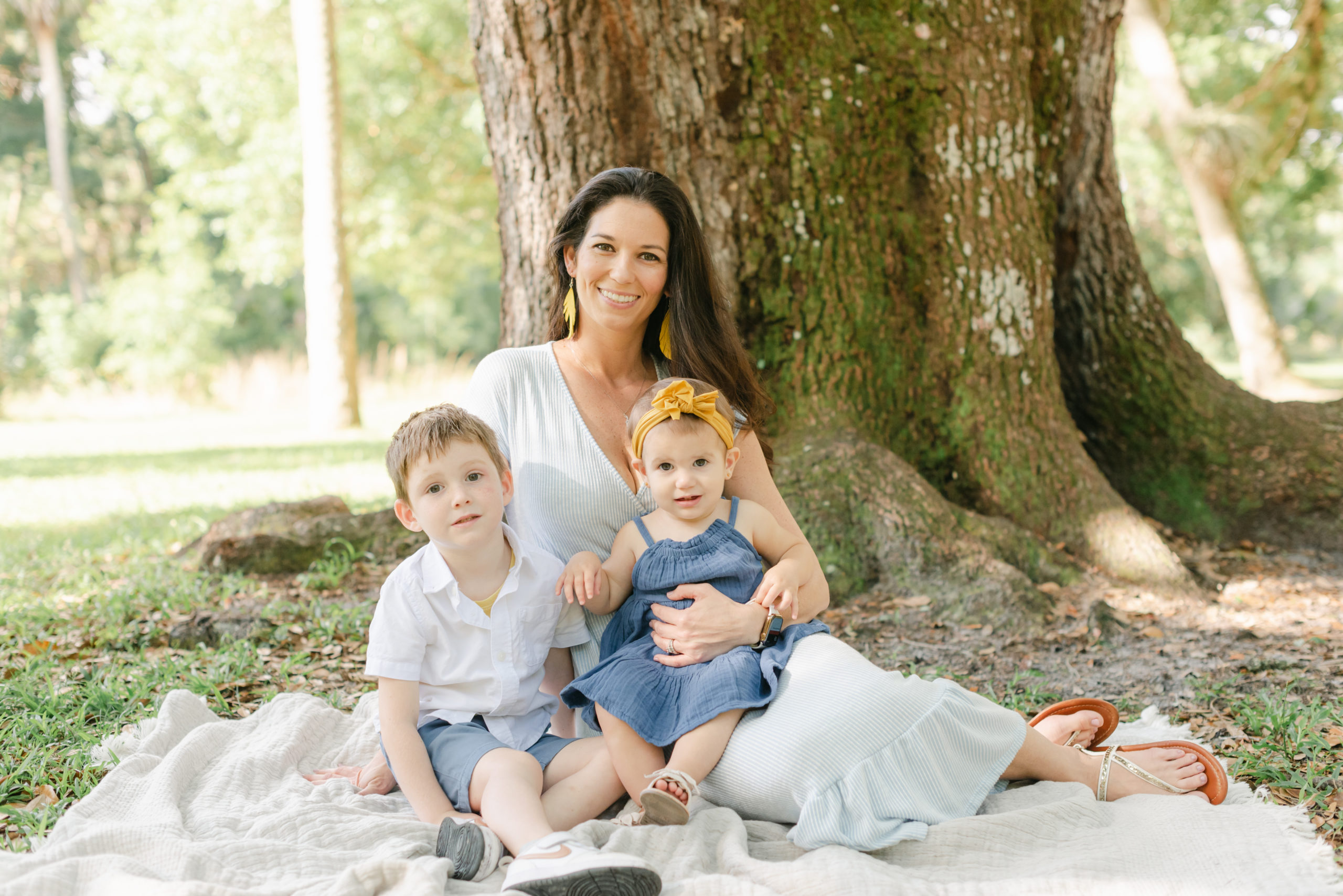 Mom sitting with her kids in lap