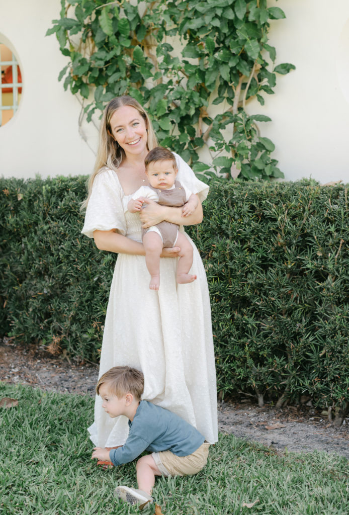 Mom holding baby look at camera smiling