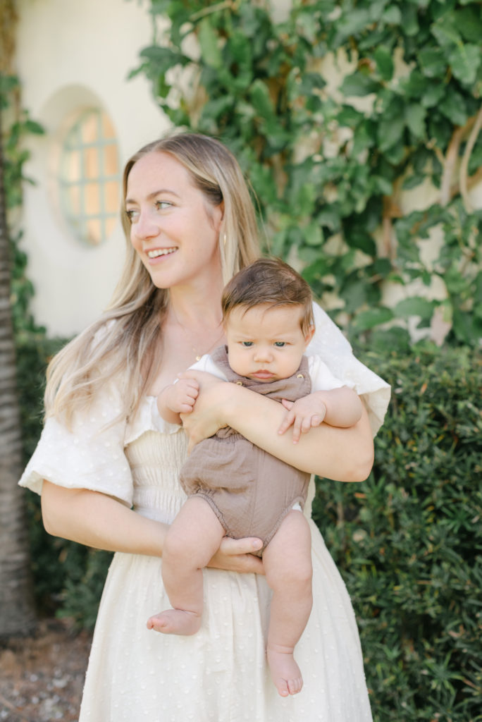 Mom looking away holding baby