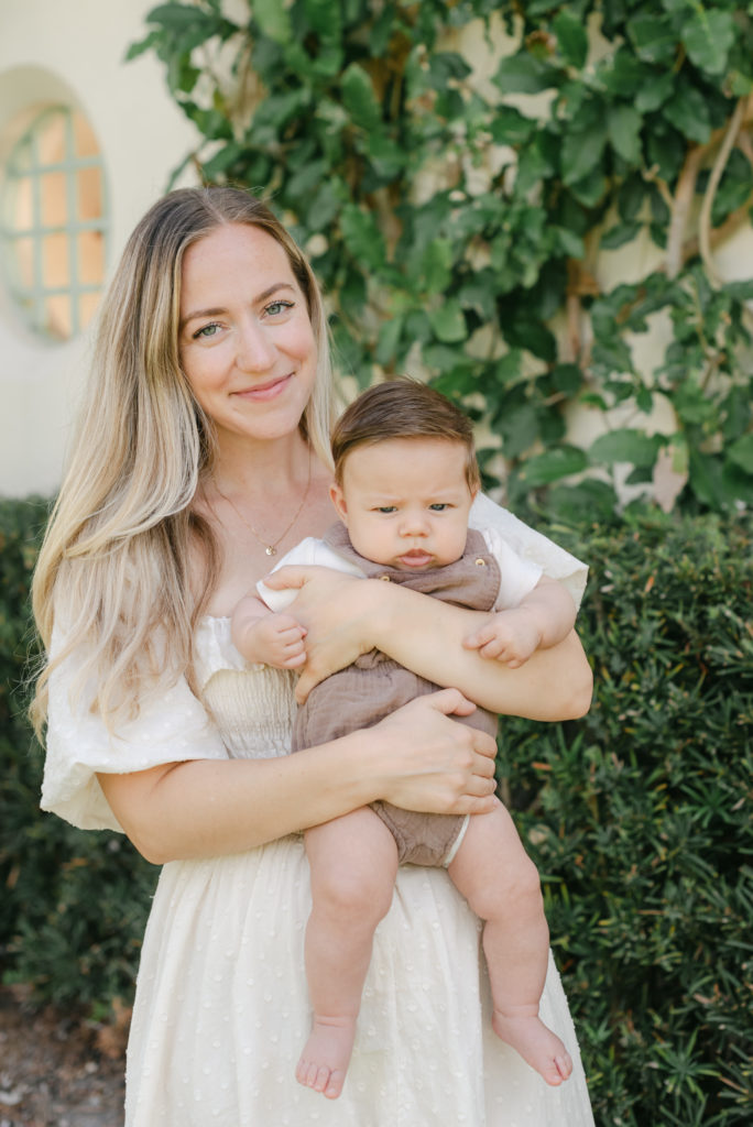 Close up of mom smiling holding baby