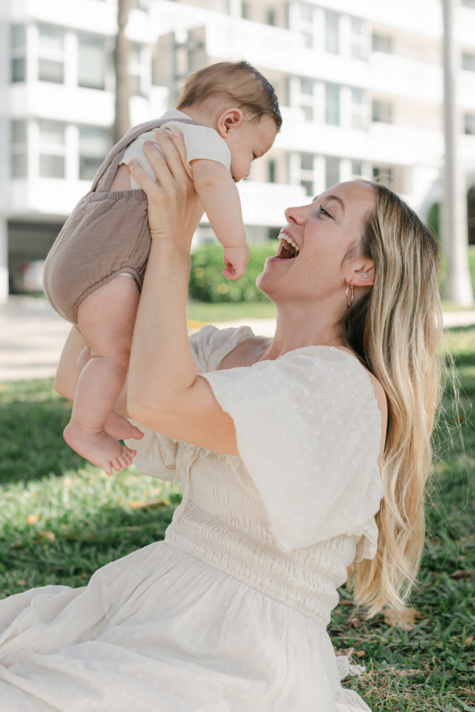 Mom holding up baby boy