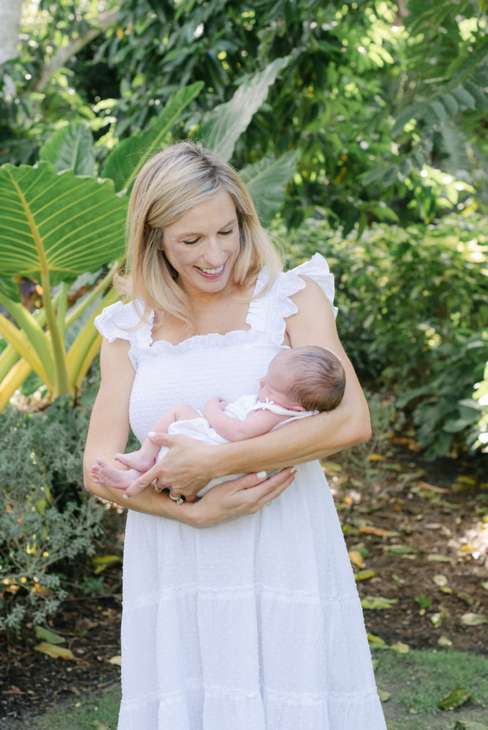 Mom holding baby looking down