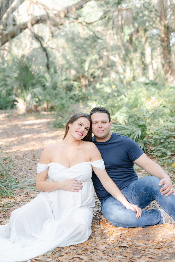 Heads touching, sitting on ground