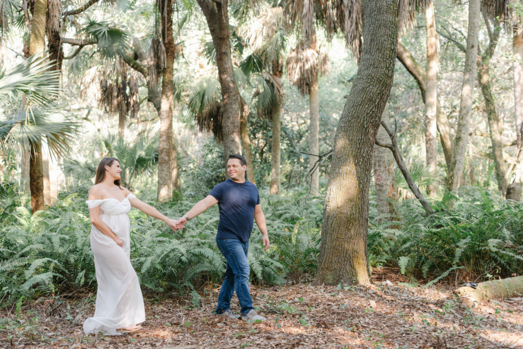 Dad leading mom out of woods