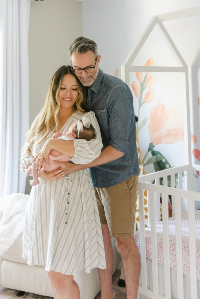 Mom and dad looking at baby