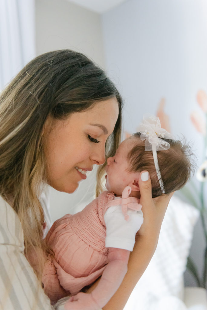 Mom and baby girl nose to nose