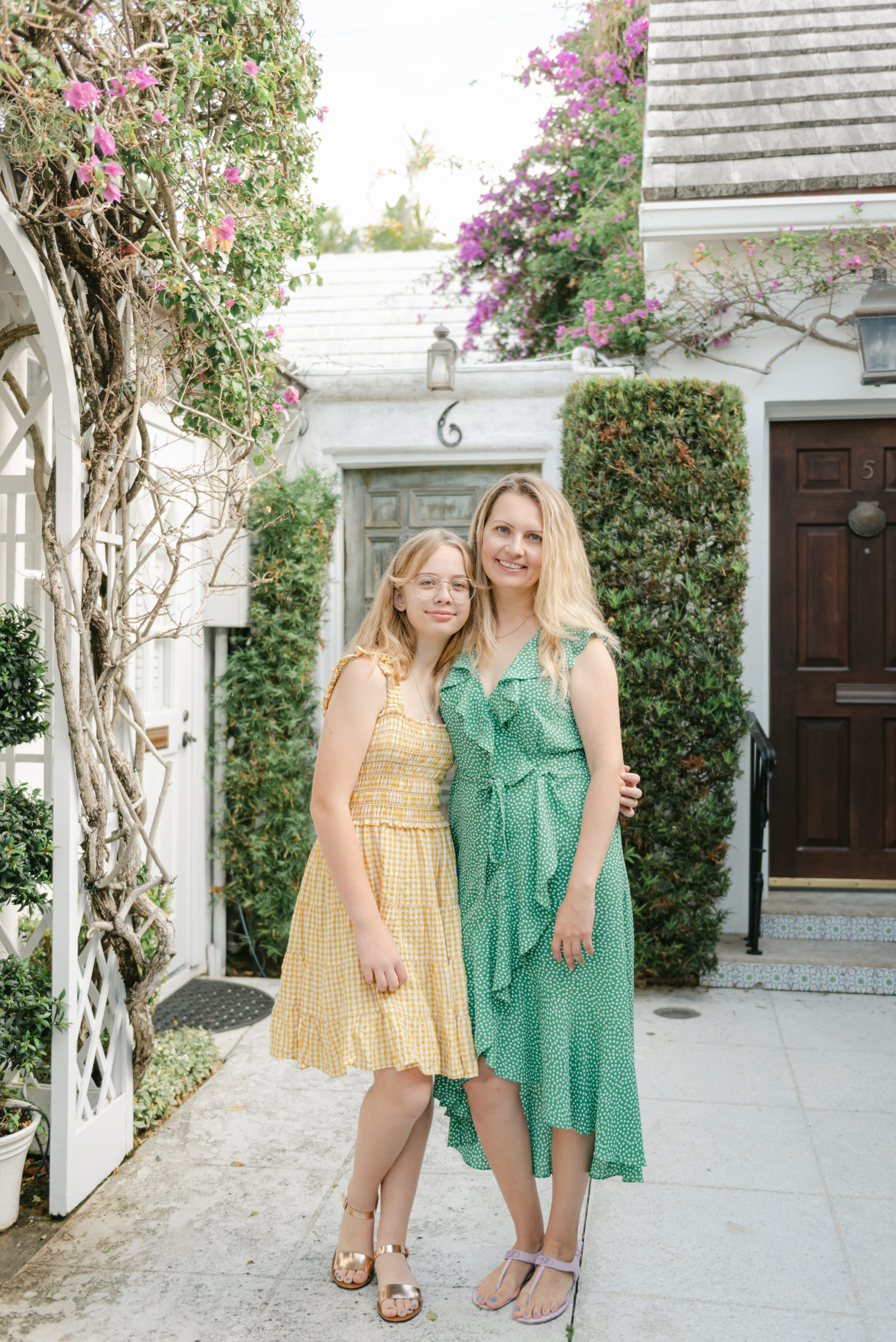 Mom and daughter smiling at camera