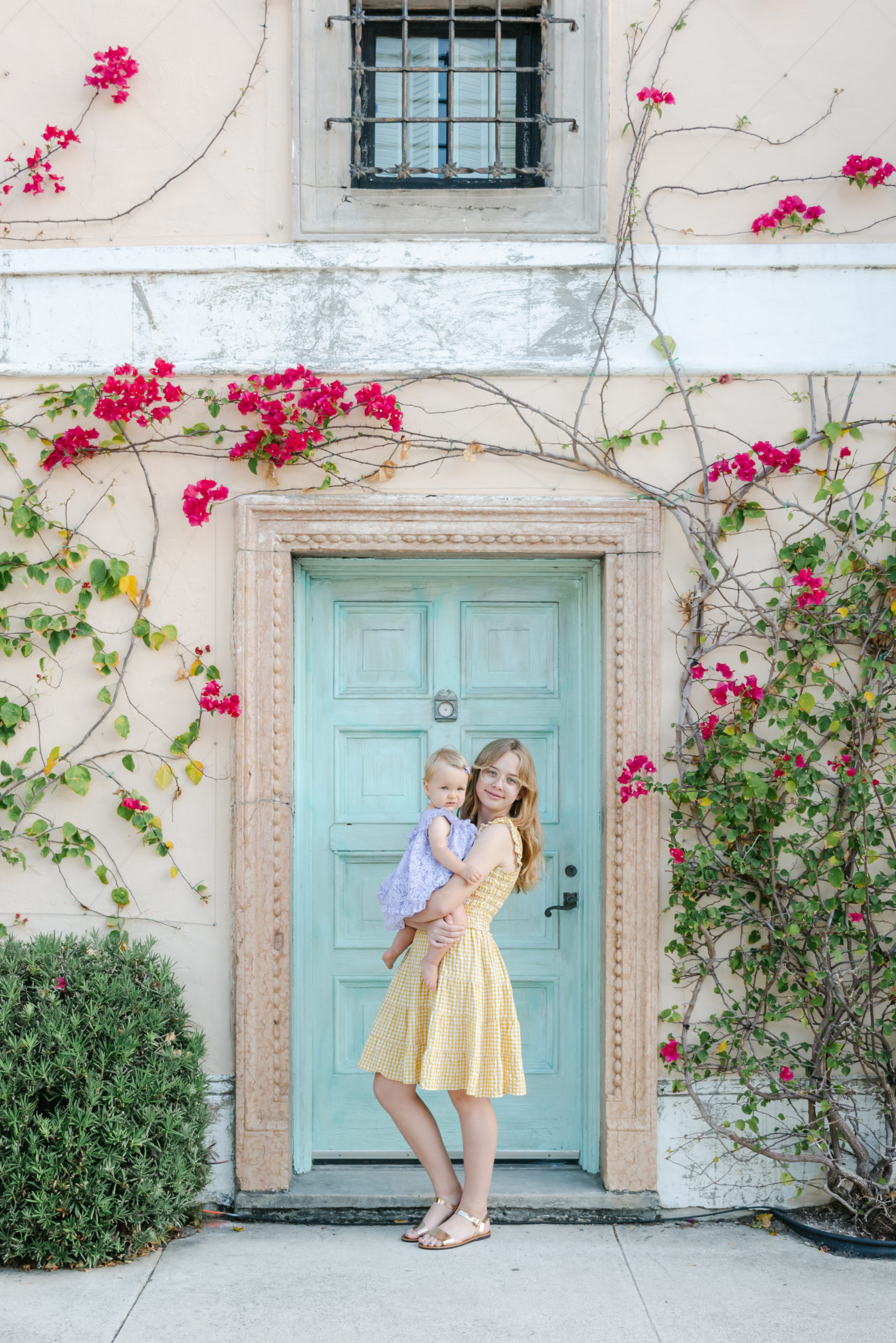 Cousins in front of blue door