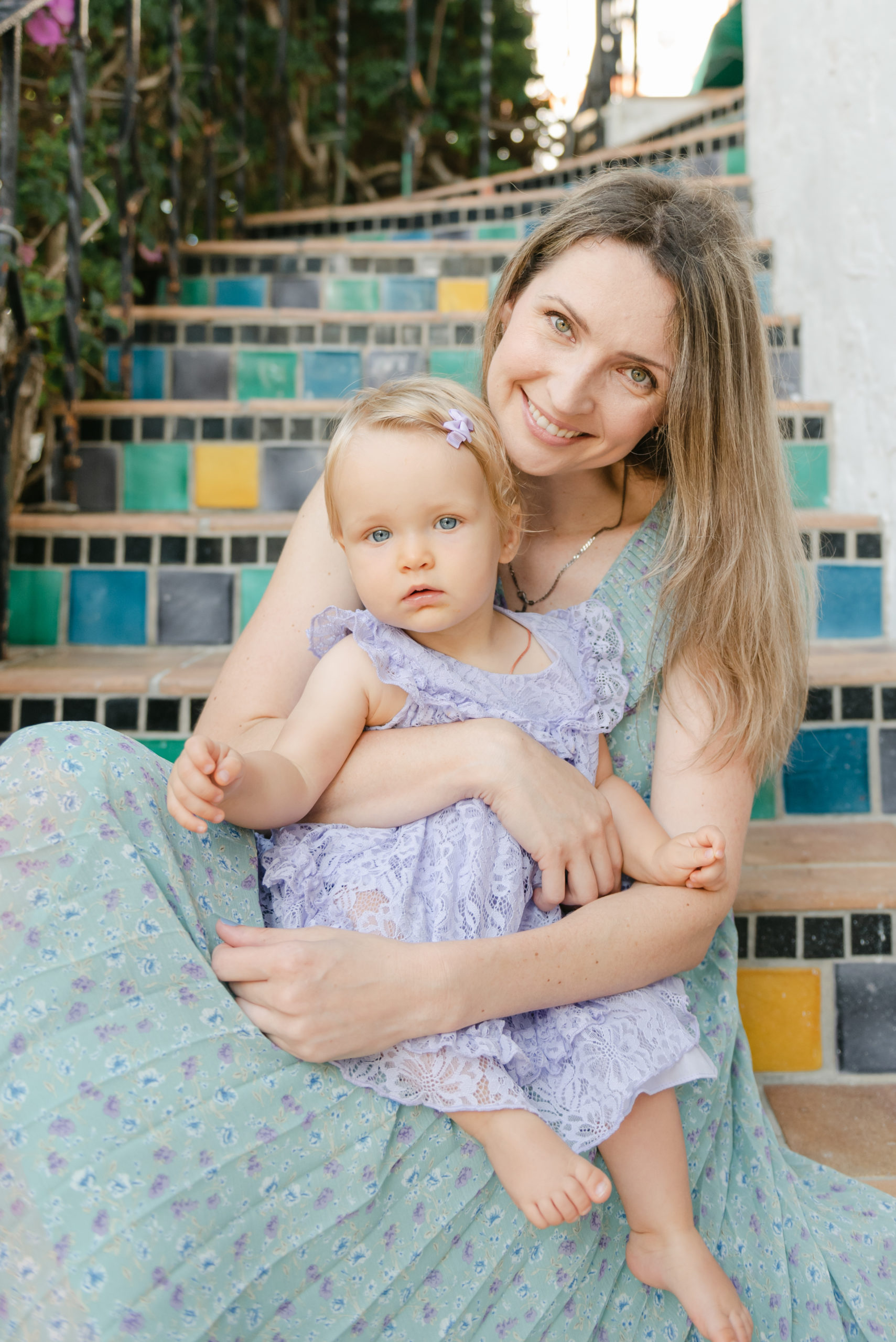 Close up of mom and daughter on steps