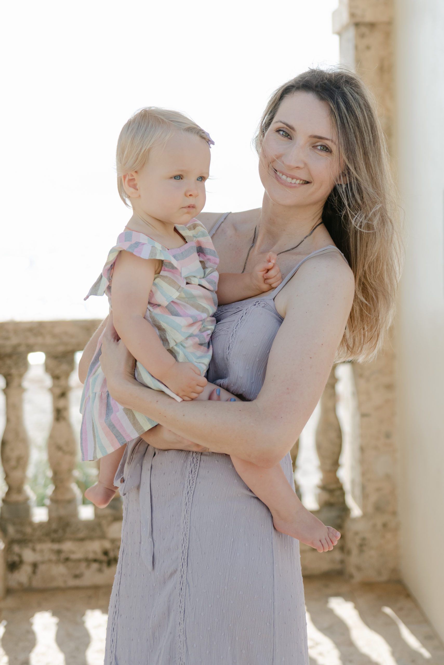 Mom and daughter by beach