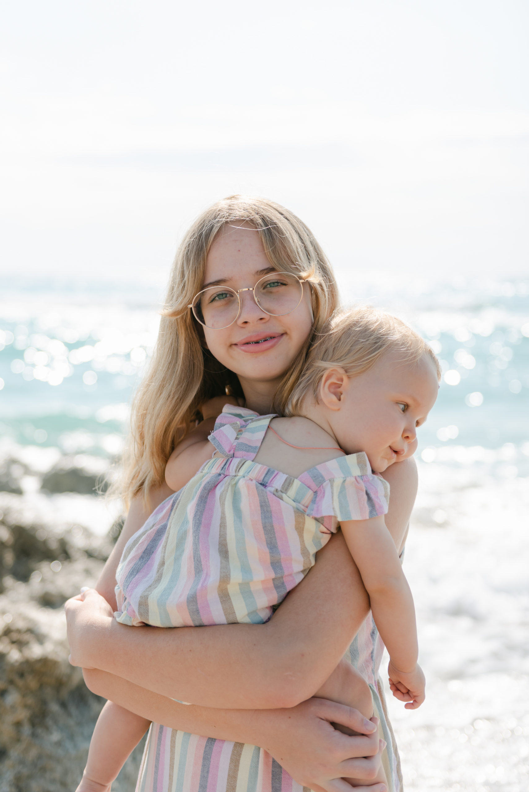 Close up of cousins on beach