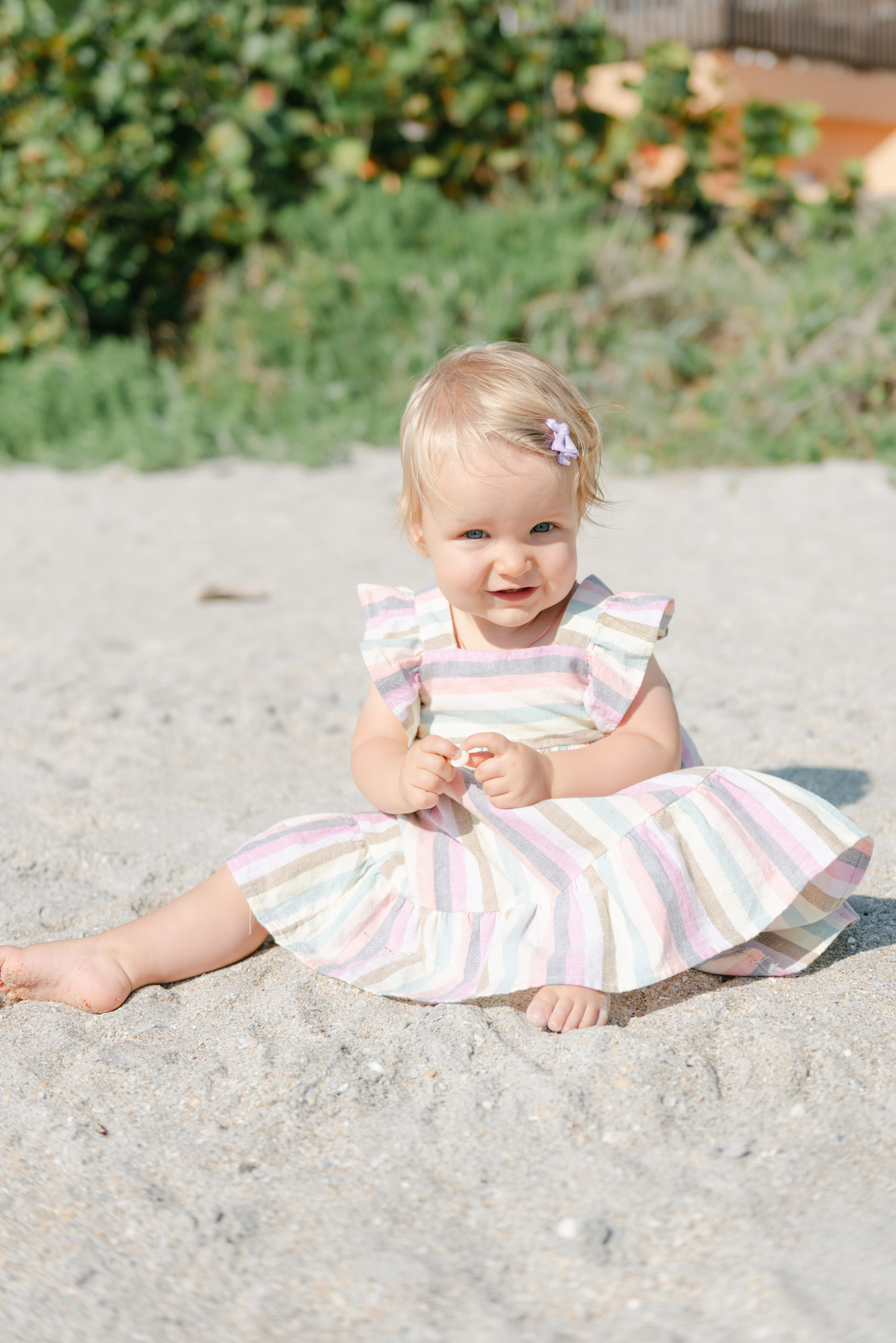 Little girl sitting in the sand