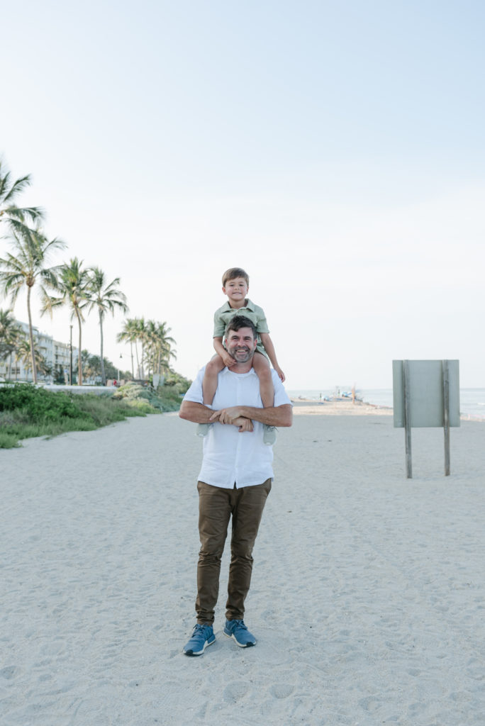 Son sitting on dad's shoulders