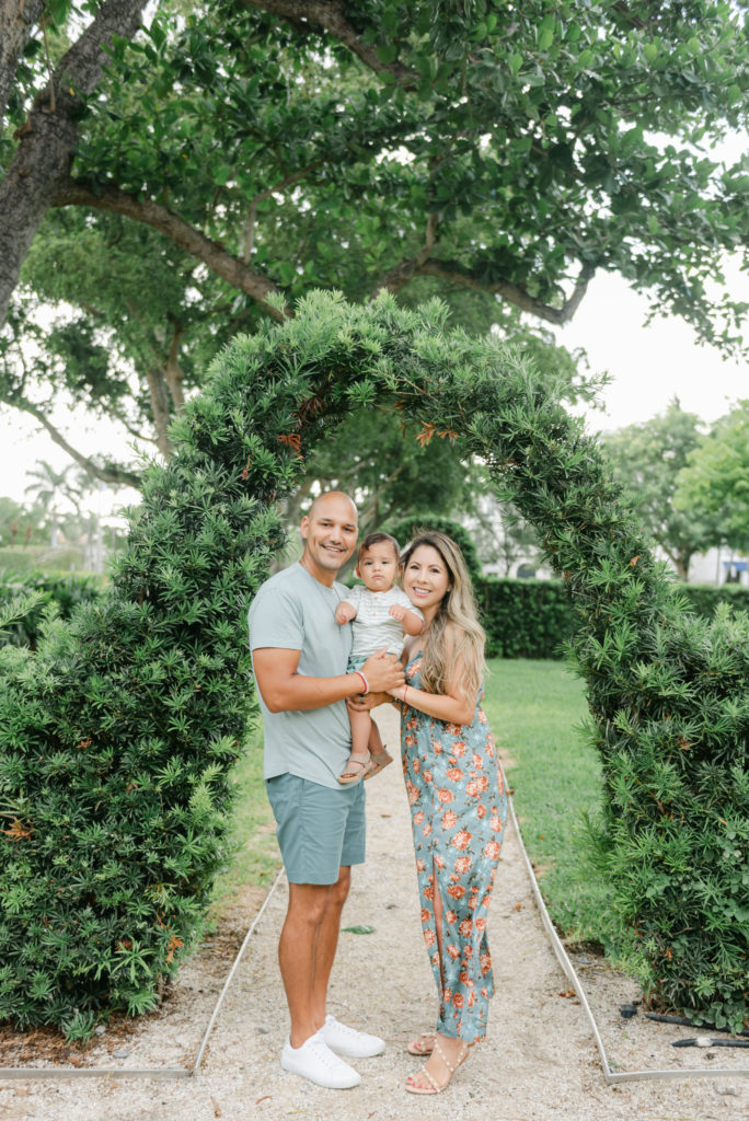 Mom, dad and son under arch