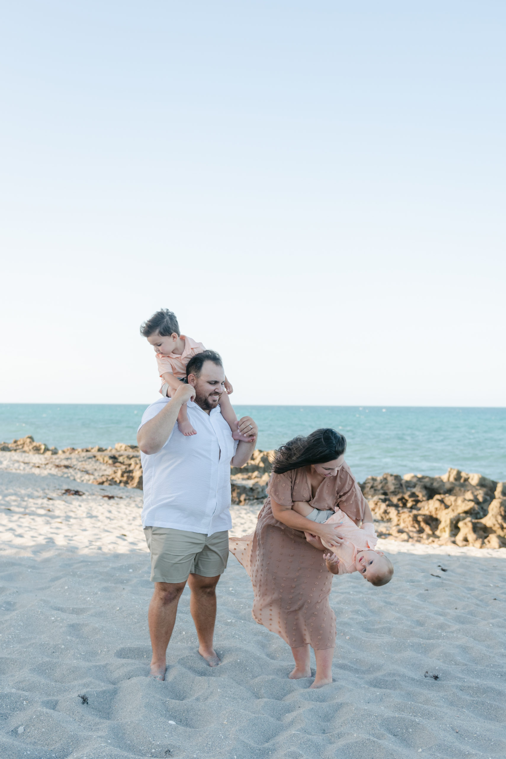 Family playing on the beach