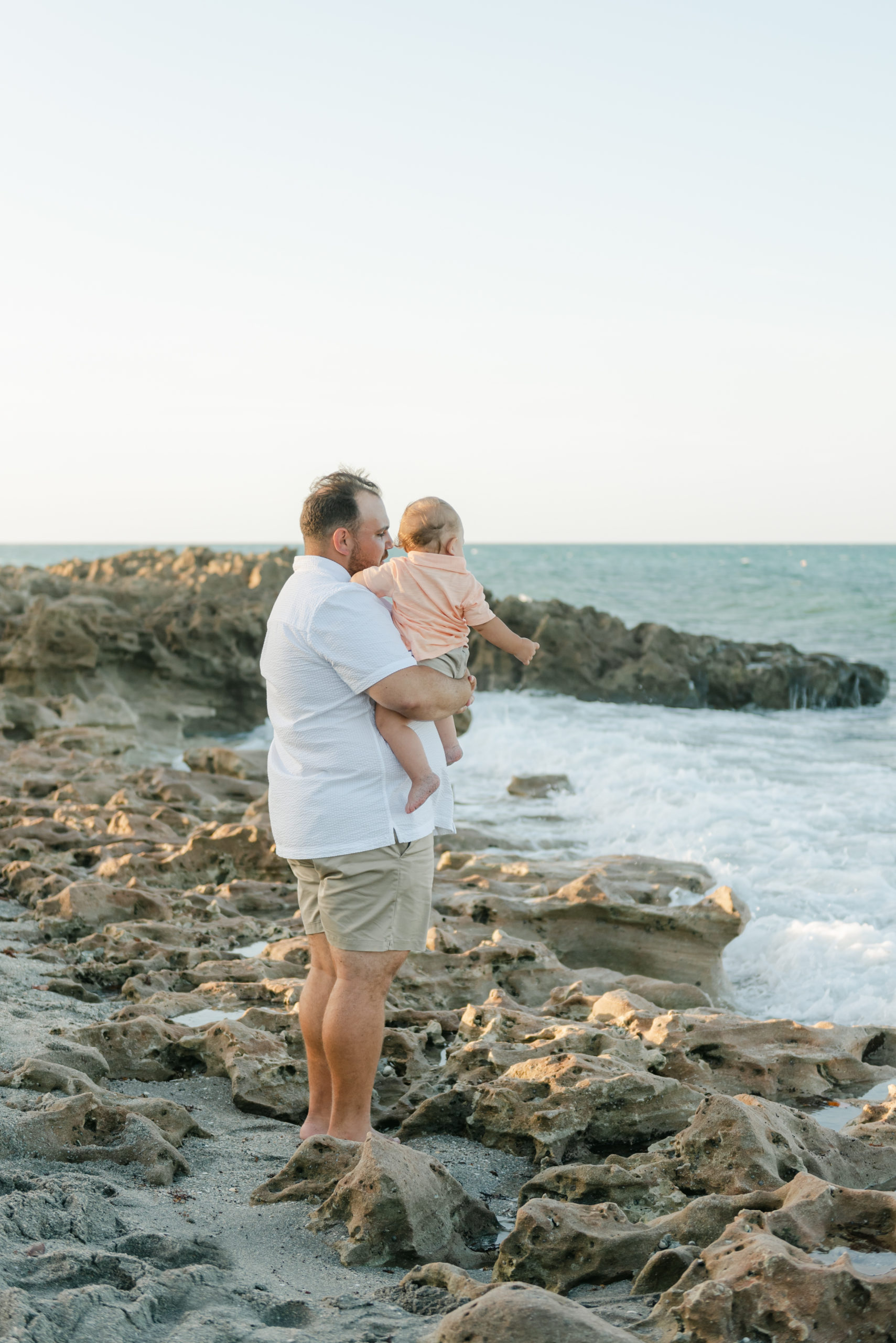 Dad looking at water with baby