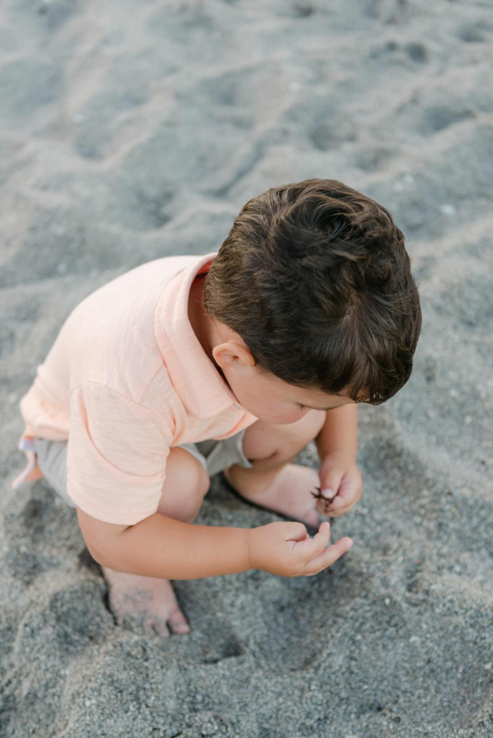 Toddler playing in the sand