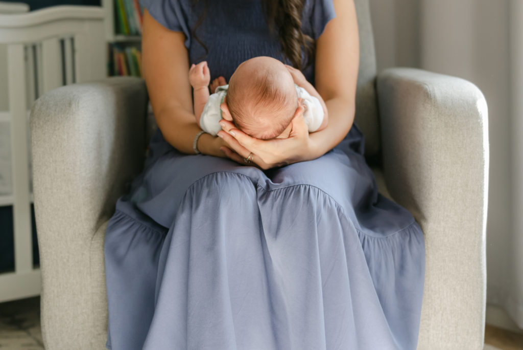 Mom cradling baby's head