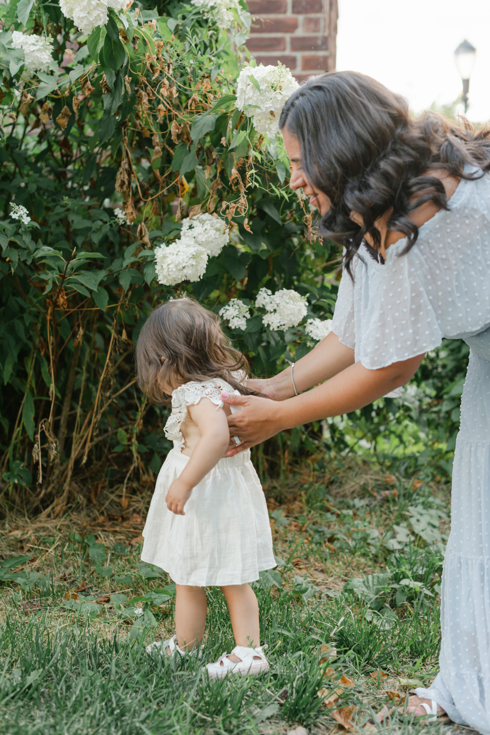 Mom holding baby girl