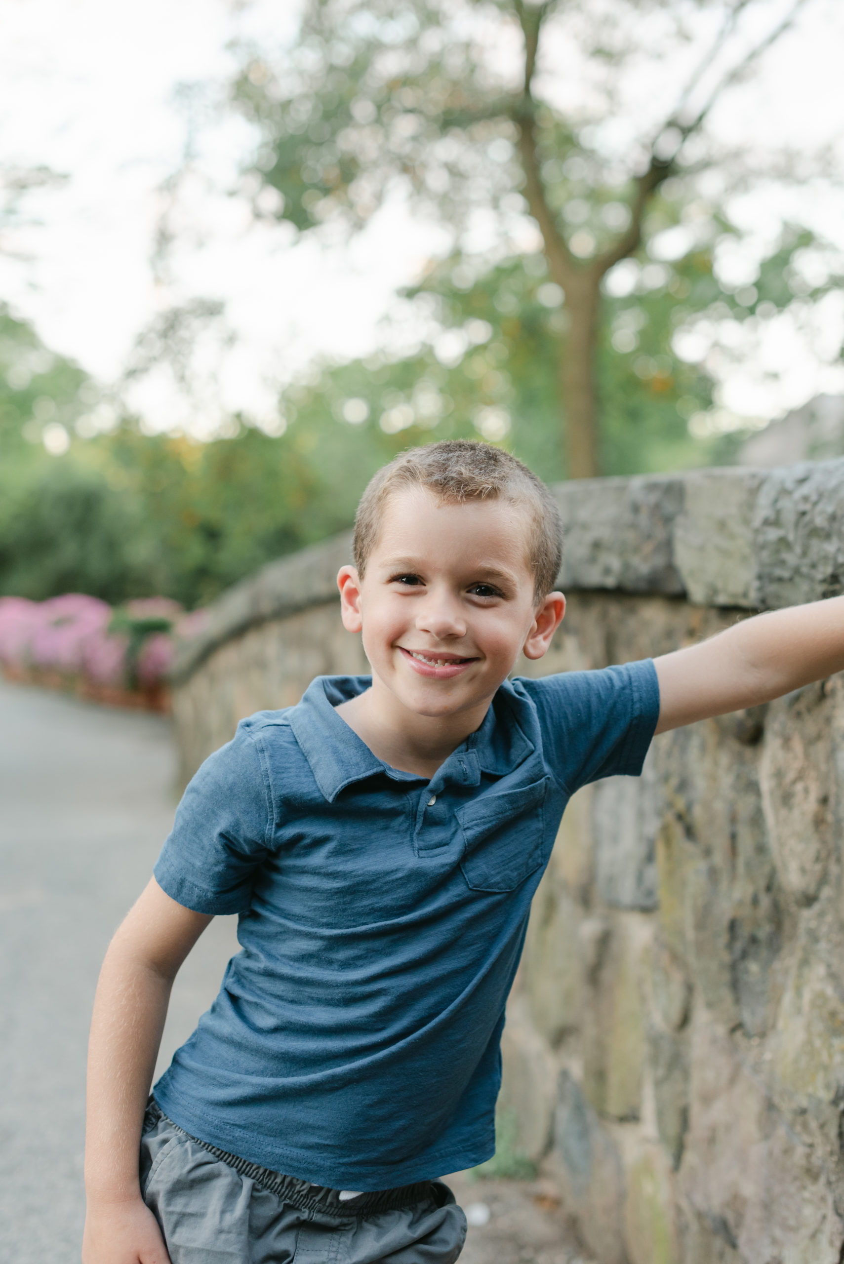 Oldest son leaning against wall