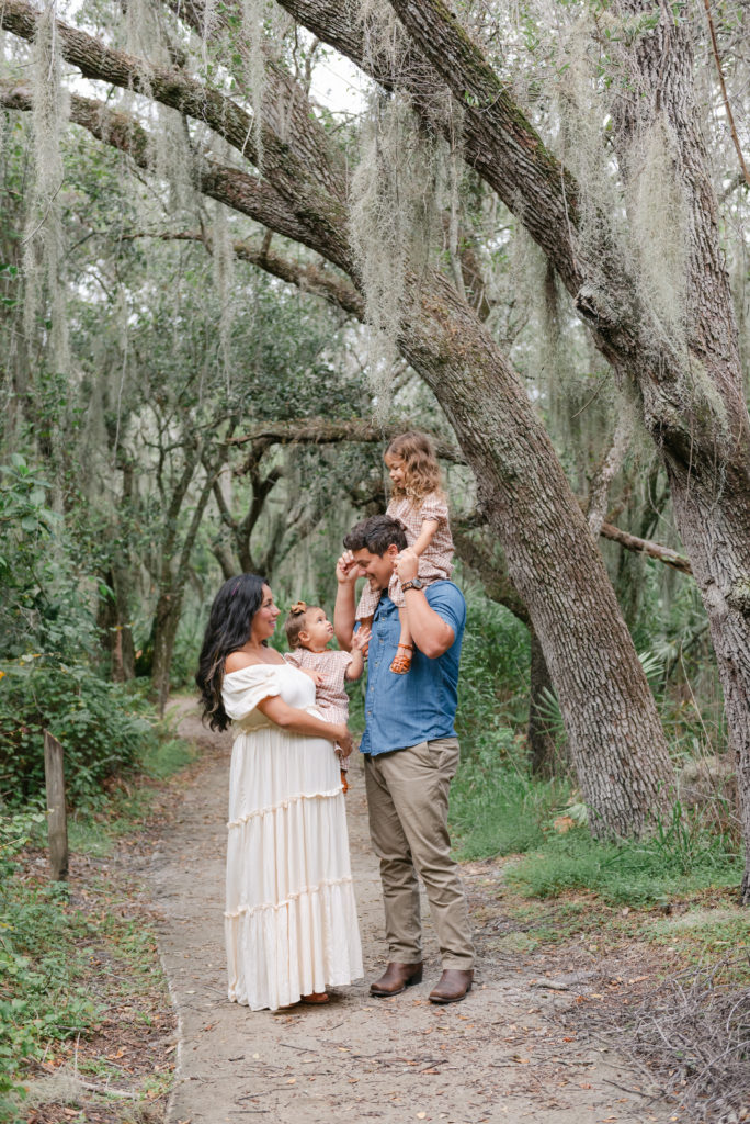 Family under spanish moss tree