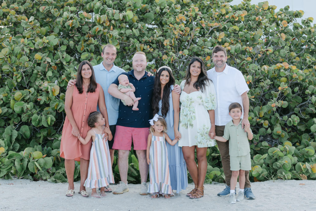 Six families with their children on the beach by Palm Beach family photographer