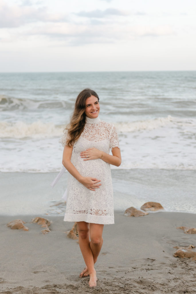 Woman smiling holding belly by Jupiter photographer