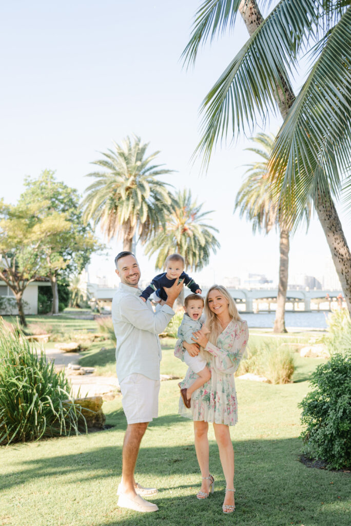Family photo in front of palm trees